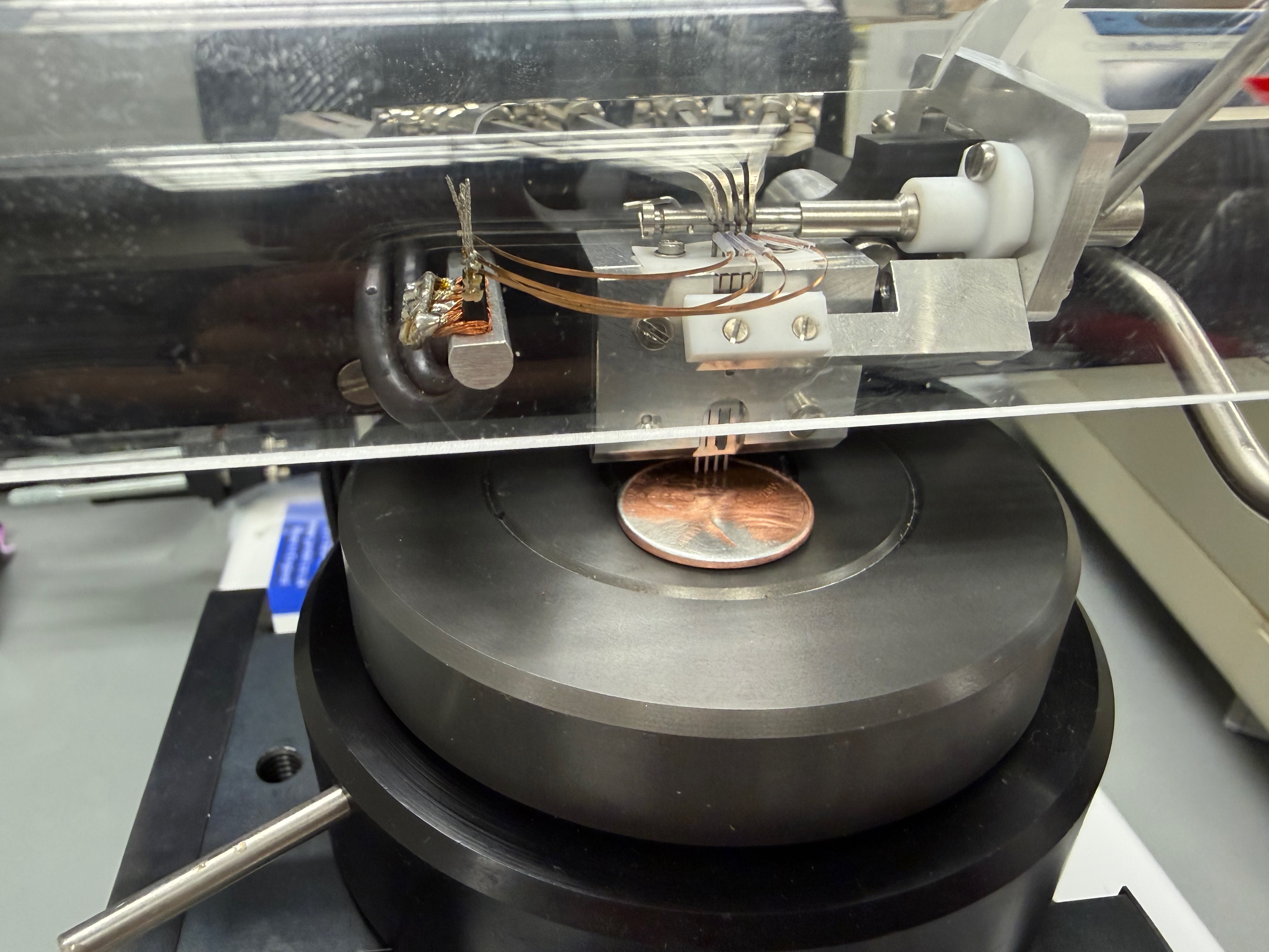 Tri-band penny under four-point probe